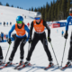 Ski athletes preparing for a competition, focusing on determination and readiness.